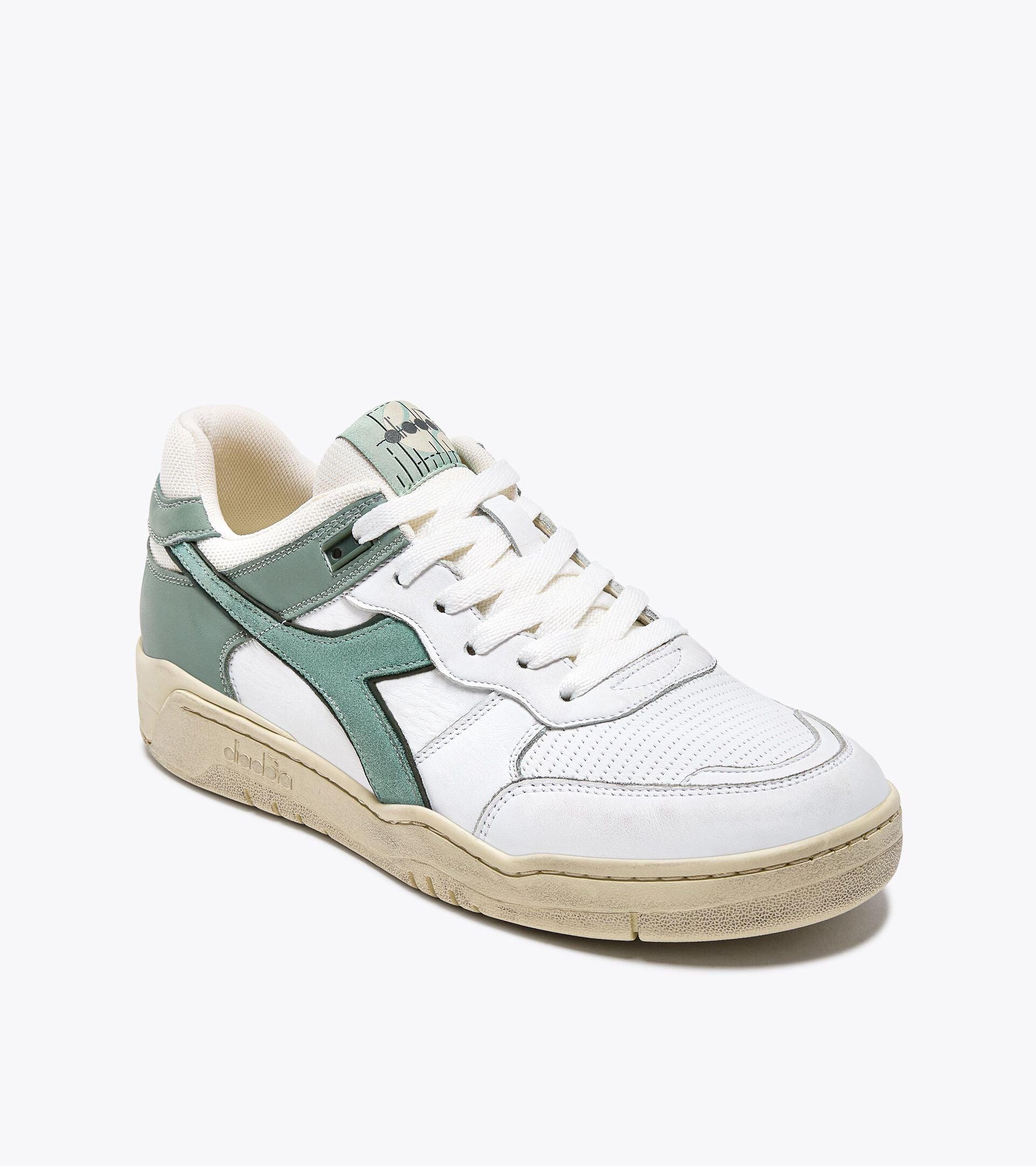 Ace Rivington Diadora B. 560 USED sneaker in Iceberg Green. The shoe features a white leather upper with green suede accents, a beige midsole, and a textured rubber outsole. The laces are white, and the tongue has a logo with the brand name.