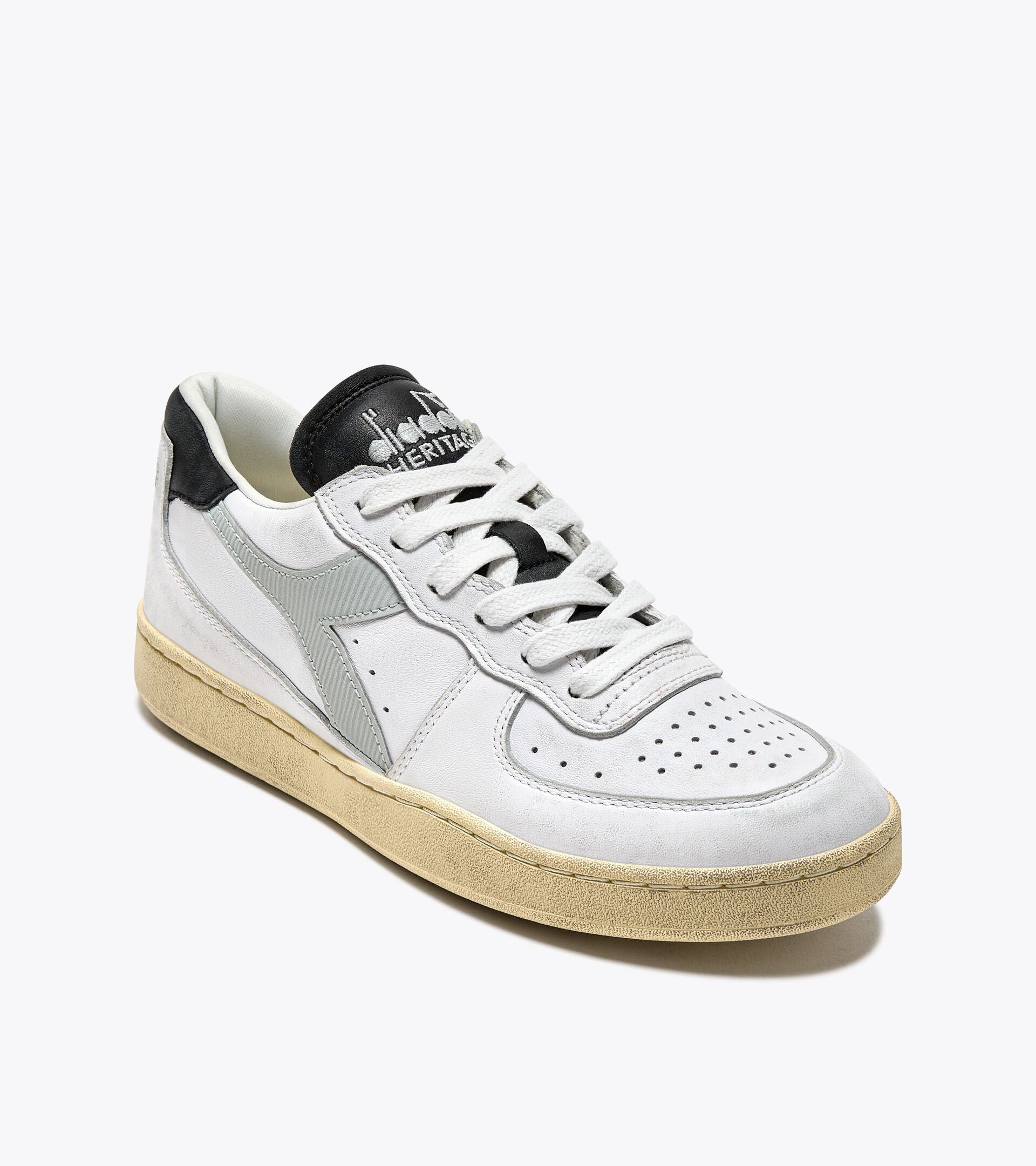 Ace Rivington Diadora - Mi Basket Low Used - White/Glacier Gray features a white leather upper with gray suede accents, a perforated toe box, and a beige rubber sole. The tongue is black with the Diadora Heritage logo in white.