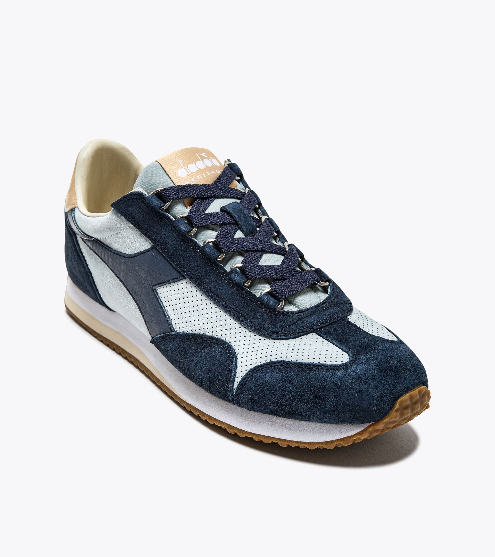 Ace Rivington Diadora Equipe Suede SW - High Rise shoe features a combination of navy blue and light grey suede with perforated detailing, a white midsole, and a gum rubber outsole. The laces are navy blue, and the tongue has a tan label with the Diadora logo and 'Heritage' text.