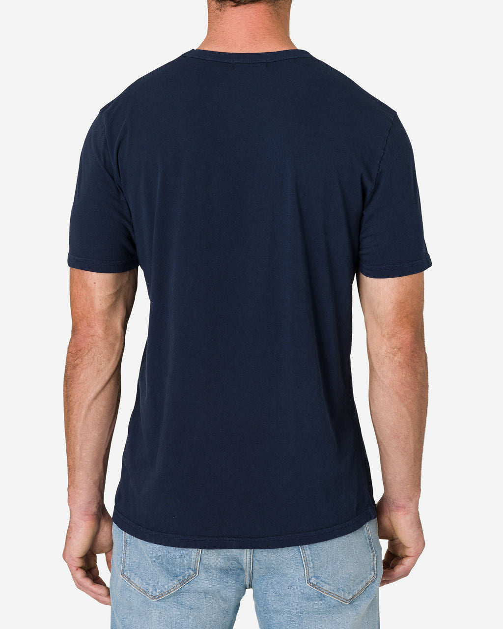 Back view of a man wearing a navy blue color Ace Rivington Super Soft Supima Cotton Tee paired with light blue jeans. The t-shirt has a simple, clean design with short sleeves and a crew neckline.