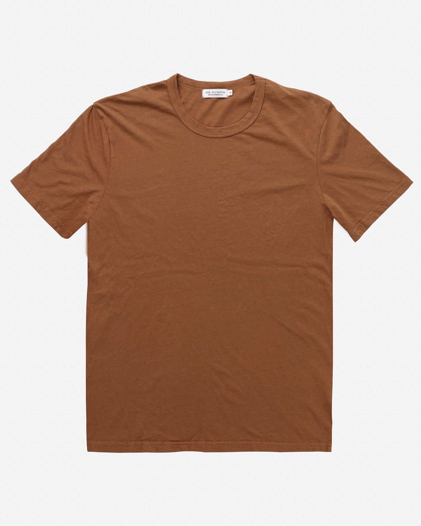 A brown color short-sleeve t-shirt made from super soft Supima cotton, labeled as Ace Rivington Super Soft Supima Cotton Tee - Sienna. The t-shirt features a simple, classic design with a round neckline and a slightly fitted cut.