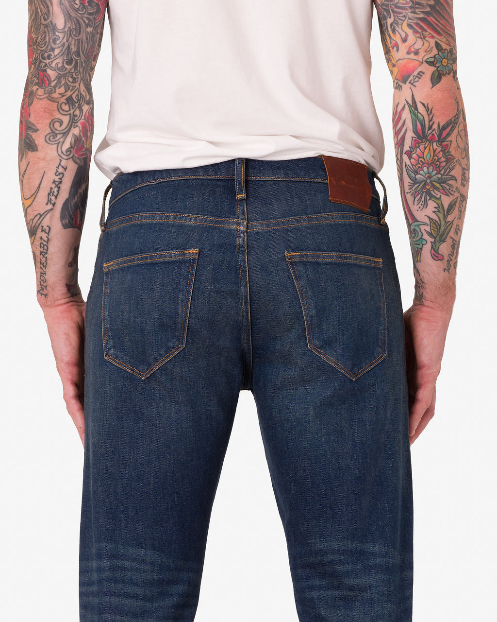 Men Show Back view of High Recovery Comfort Stretch Fabric Ace Rivington - Athletic Straight Denim Jeans - Dirty Vintage Color Wearing a Plain White Shirt.