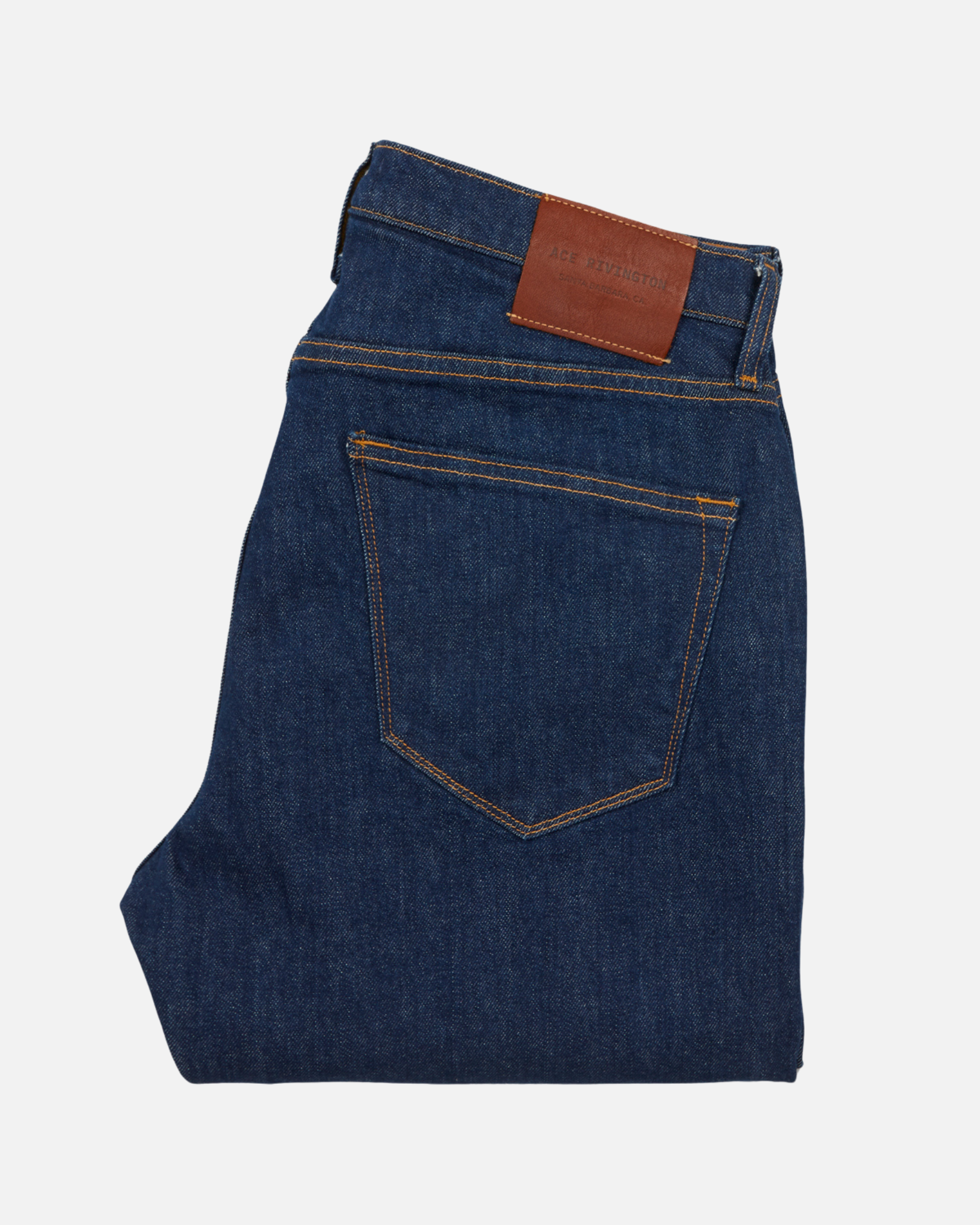 back of folded dark blue men's athletic taper jeans with no wear