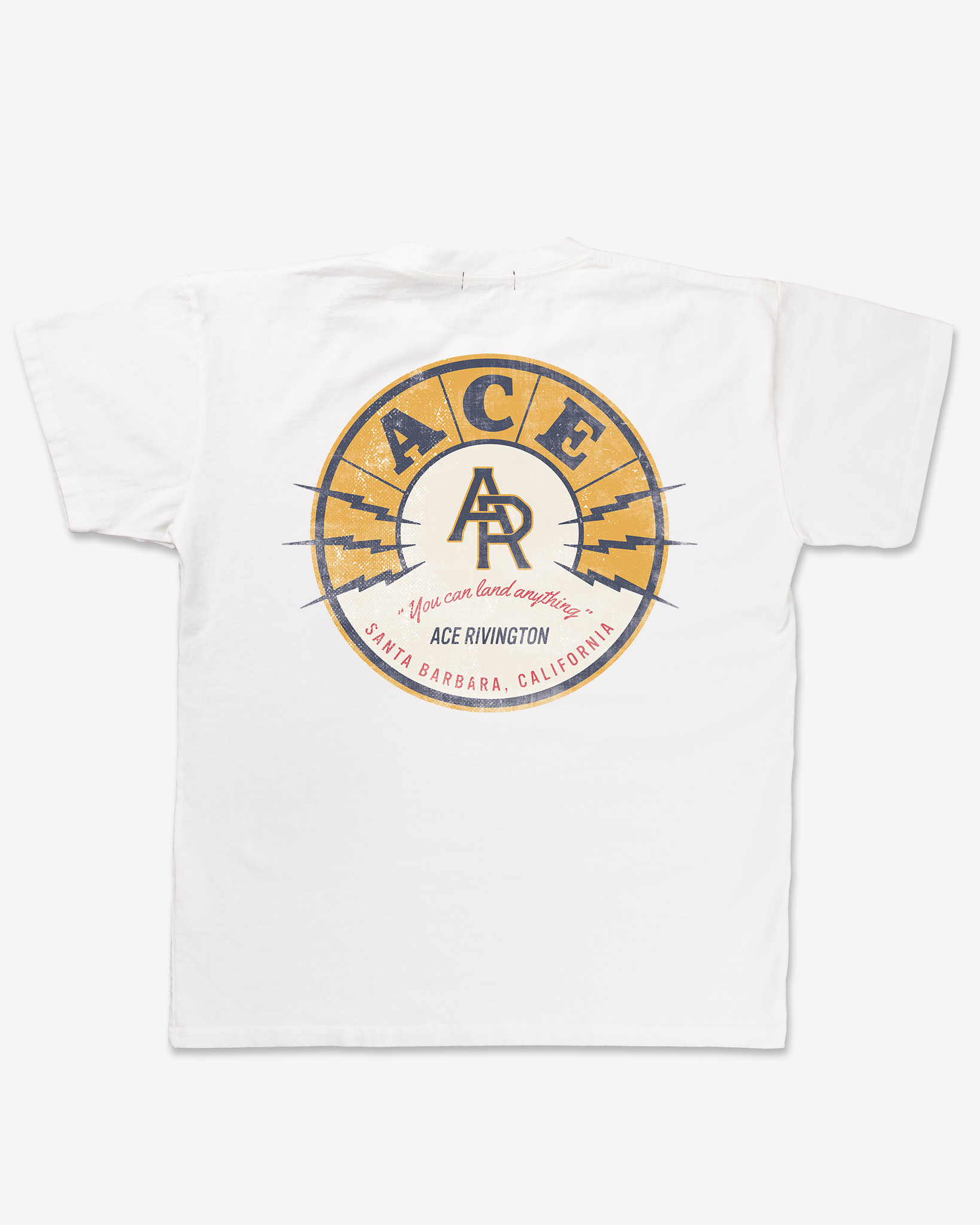 Record white color Heavy Tee - Crewneck SS T-shirt from Ace Rivington. The back of the T-shirt features a large circular graphic with a yellow and blue design. The word 'ACE' is prominently displayed at the top of the circle, with the letters 'AR' in the center. Below the circle, the text reads 'You can land anything' and 'ACE RIVINGTON' in smaller font. At the bottom, it says 'SANTA BARBARA, CALIFORNIA' in red letters.