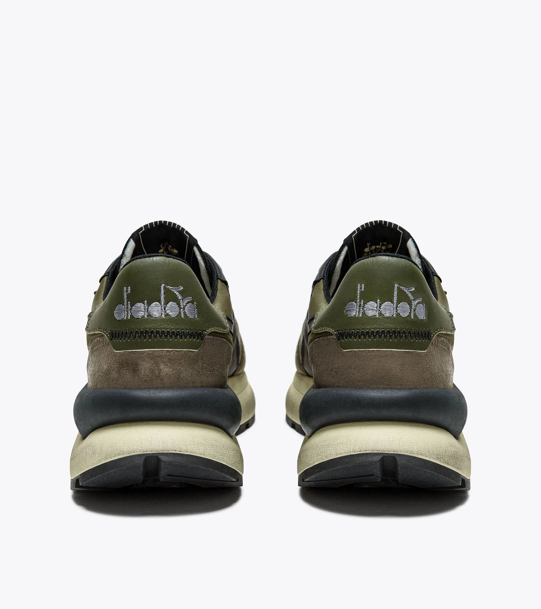 Rear view of the Ace Rivington Diadora - Mercury Elite - Beech Green, highlighting the retro-inspired design with embroidered Diadora branding, a mix of suede and leather materials, and the oversized stabilizer. The olive green and brown tones emphasize its 1970s track shoe aesthetic.