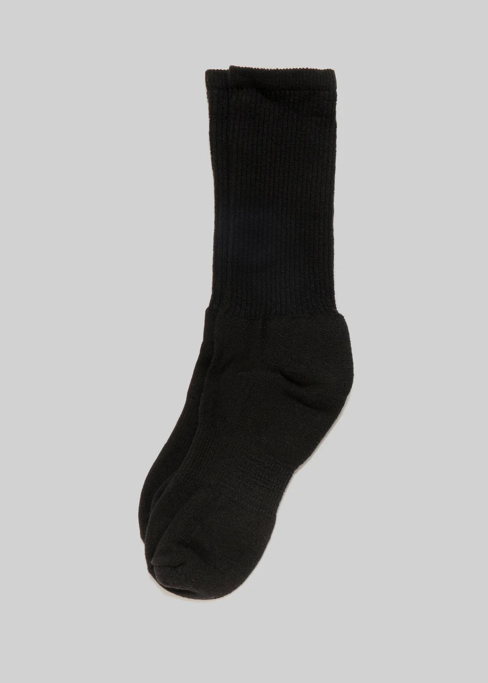 Pair of black Ace Rivington Mil-Spec Sport Socks displayed against a plain light-gray background. The socks are mid-calf length with a ribbed texture on the upper part and a smooth finish on the foot area. The design highlights the durability and functional style of these sports socks, making them suitable for various physical activities.