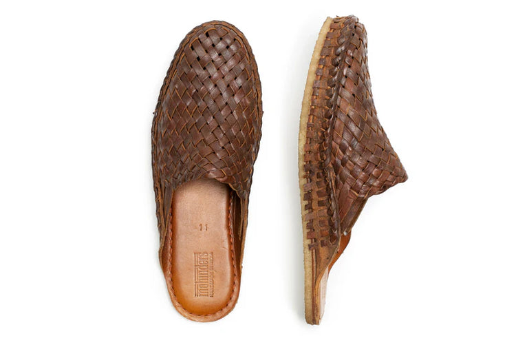 A pair of Ace Rivington Men's Woven City Slippers in Walnut. The slippers feature a woven leather design in a rich brown color. One slipper is shown from the top view, displaying the intricate weaving pattern and the insole marked with the brand's logo and size 11. The other slipper is shown from the side, highlighting the texture and craftsmanship of the woven leather and the light-colored sole.