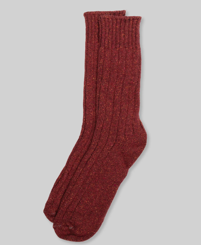 A pair of Ace Rivington Wool Silk Boot Sock - Rust with a ribbed texture, laid flat against a light gray background, showcasing their thickness and warmth. The socks are made of a soft, cozy blend of wool and silk, making them perfect for cold-weather wear.