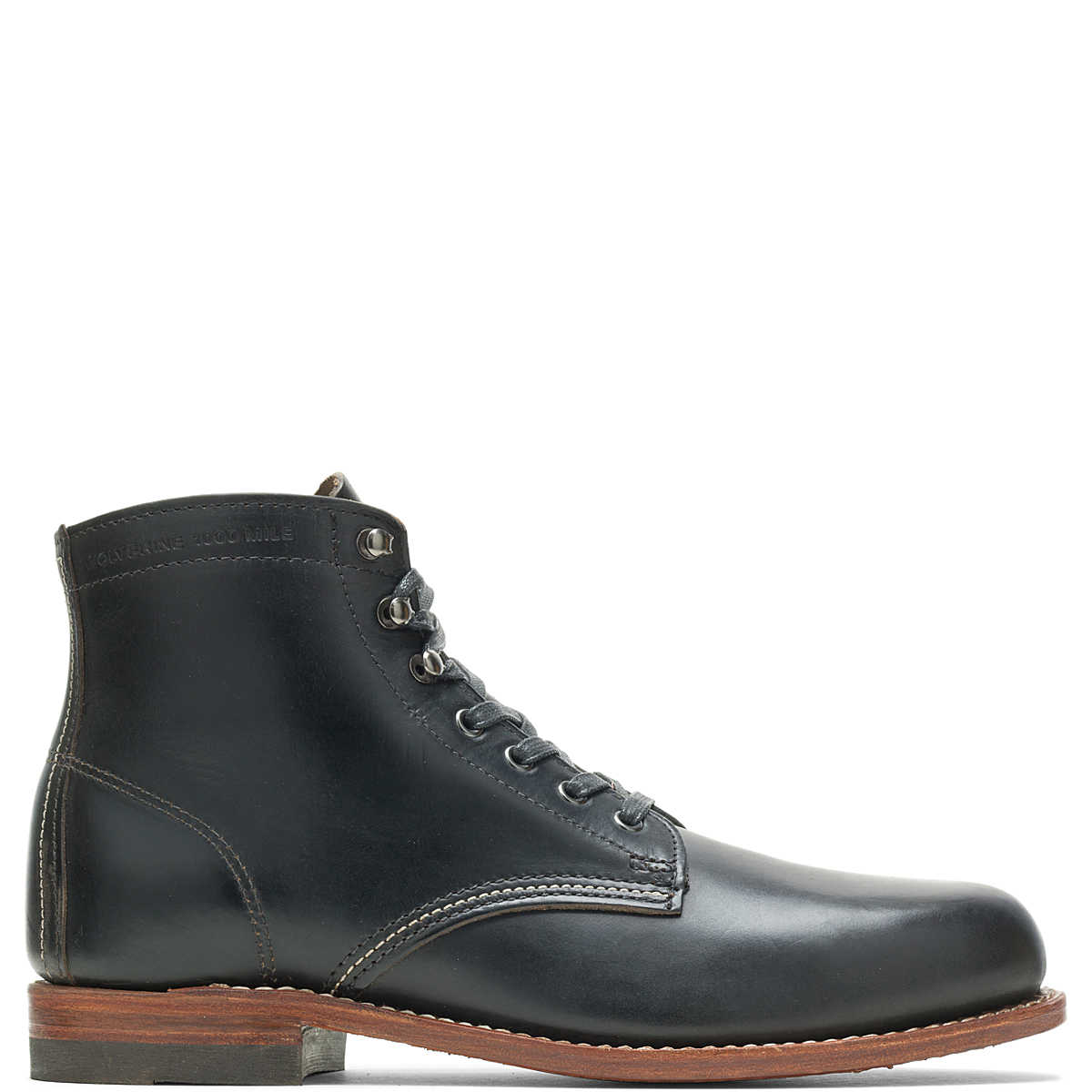 Black leather Ace Rivington Wolverine - 1000 Mile - Plain Toe Original Boot features a sleek design with a plain toe, metal eyelets for the laces, and a contrasting brown leather sole with a slight heel. The visible stitching adds to the boot's classic and durable appearance.