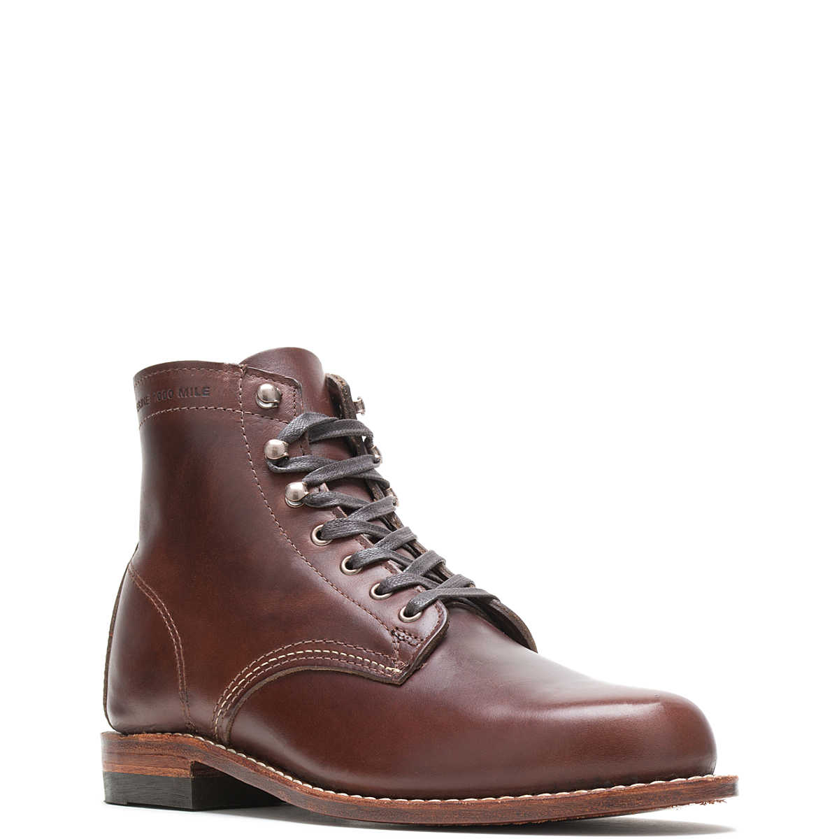 Ace Rivington Wolverine - 1000 Mile - Plain Toe Original brown boot leather, featuring a classic lace-up design with metal eyelets, a smooth toe, and a wooden sole with a slight heel.