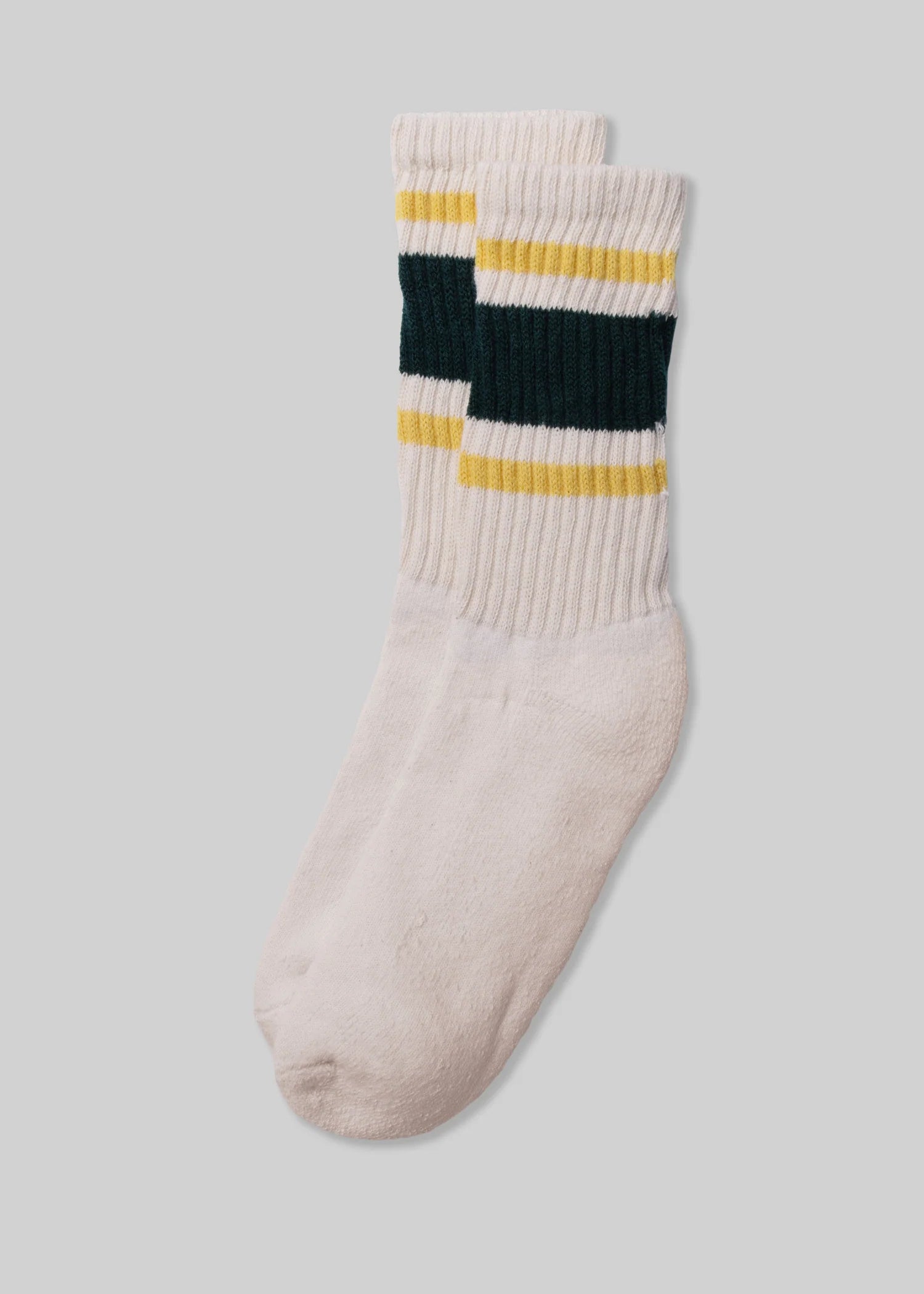 A pair of Ace Rivington American Trench Retro Stripe white socks with a ribbed upper section featuring retro stripes in yellow and dark green. The design is reminiscent of vintage athletic socks, adding a nostalgic and stylish touch