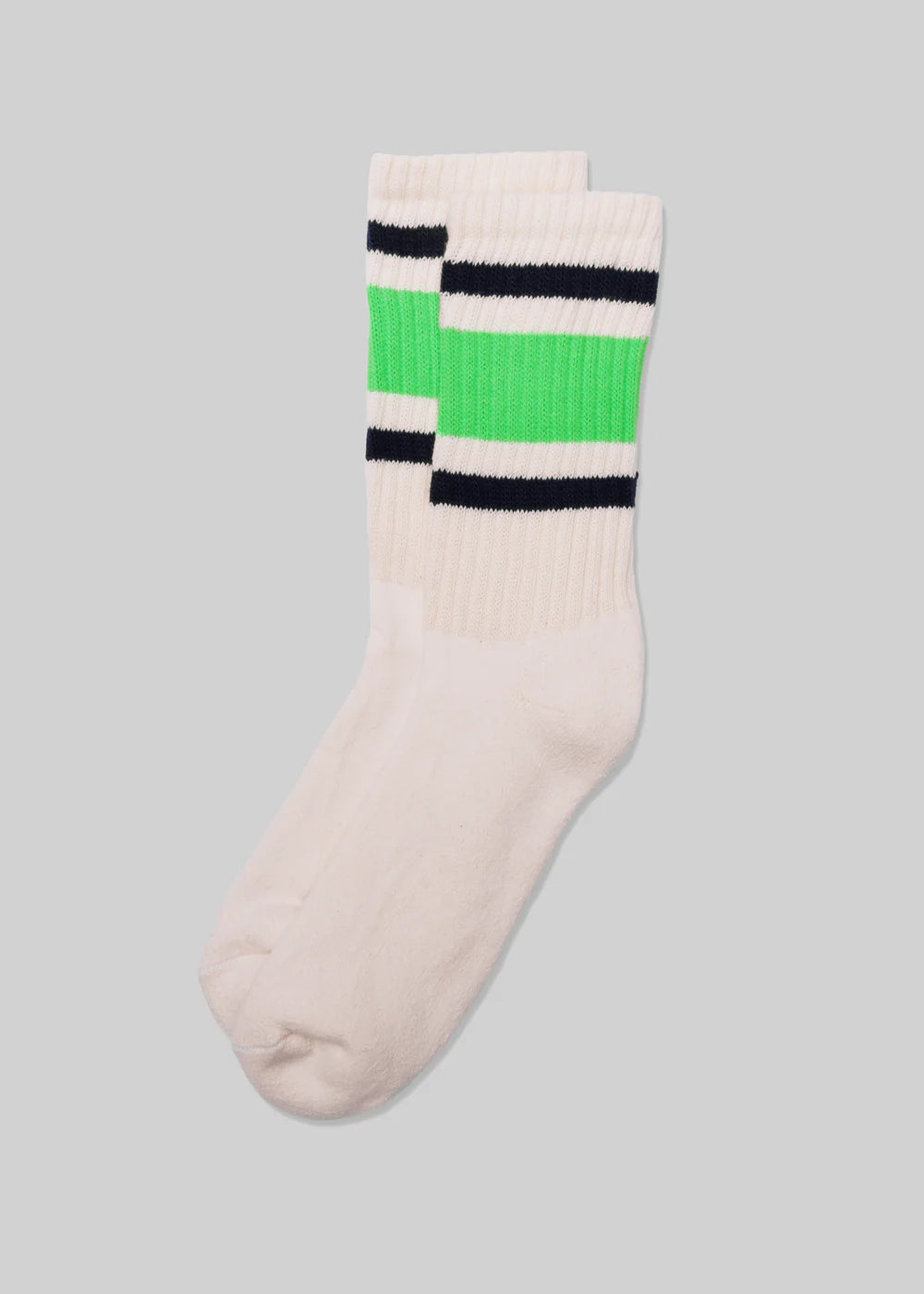 A pair of Ace Rivington American Trench Retro Stripe white socks with a ribbed upper section featuring retro stripes in black, white, and light green. The design is reminiscent of vintage athletic socks, adding a nostalgic and stylish touch.